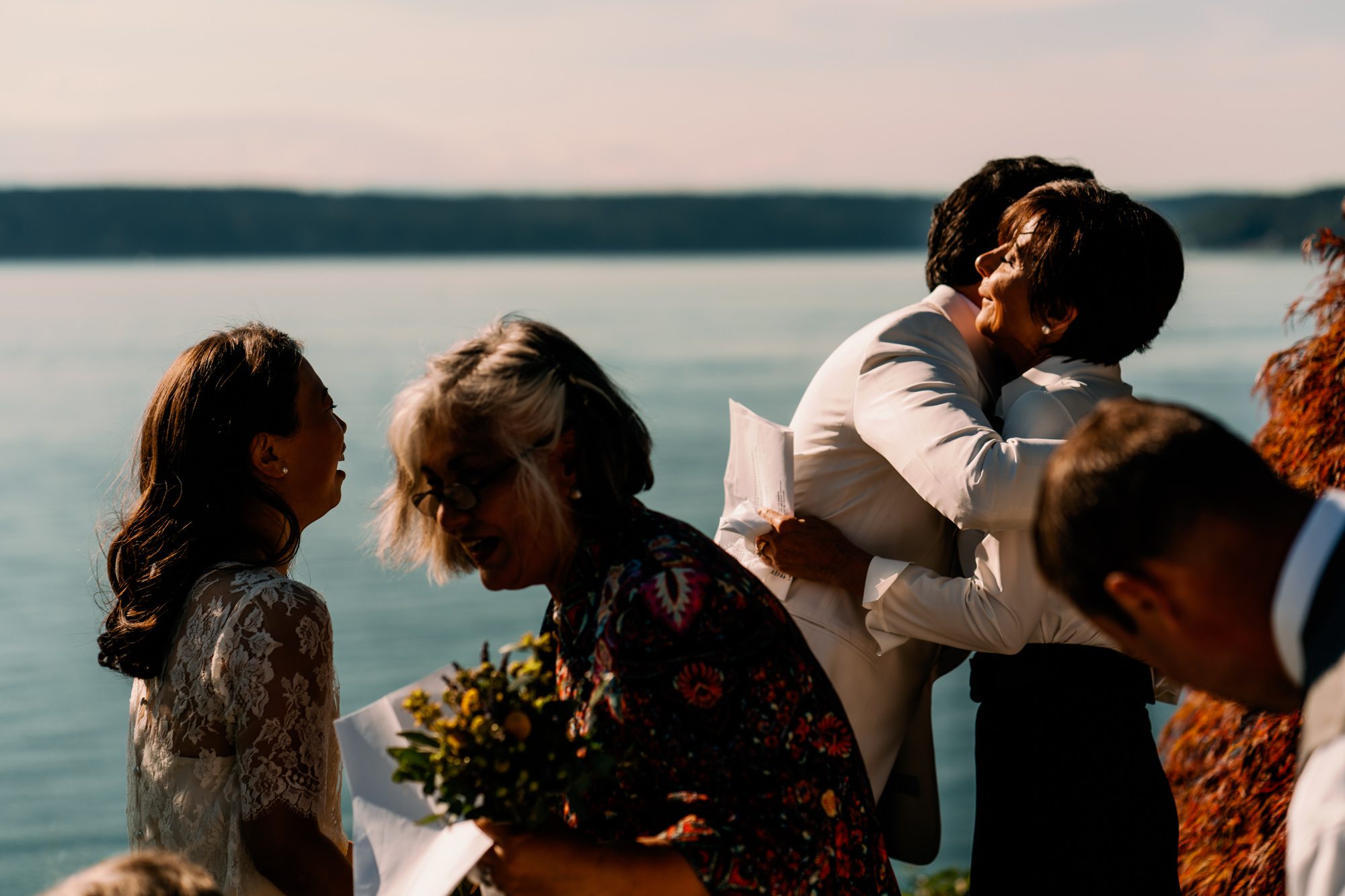Jen and Sage hug their moms