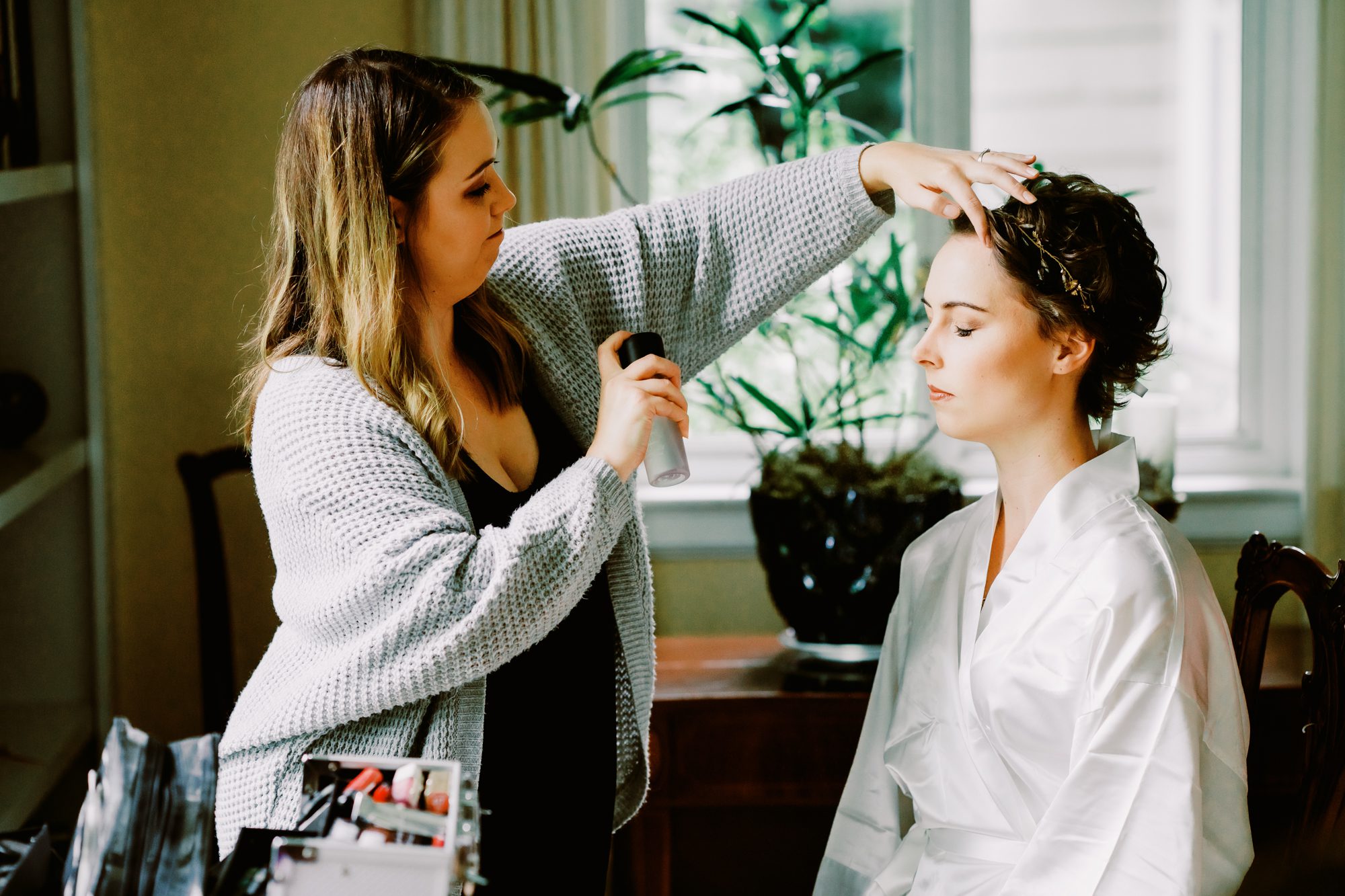 Bride Amy getting her makeup finished