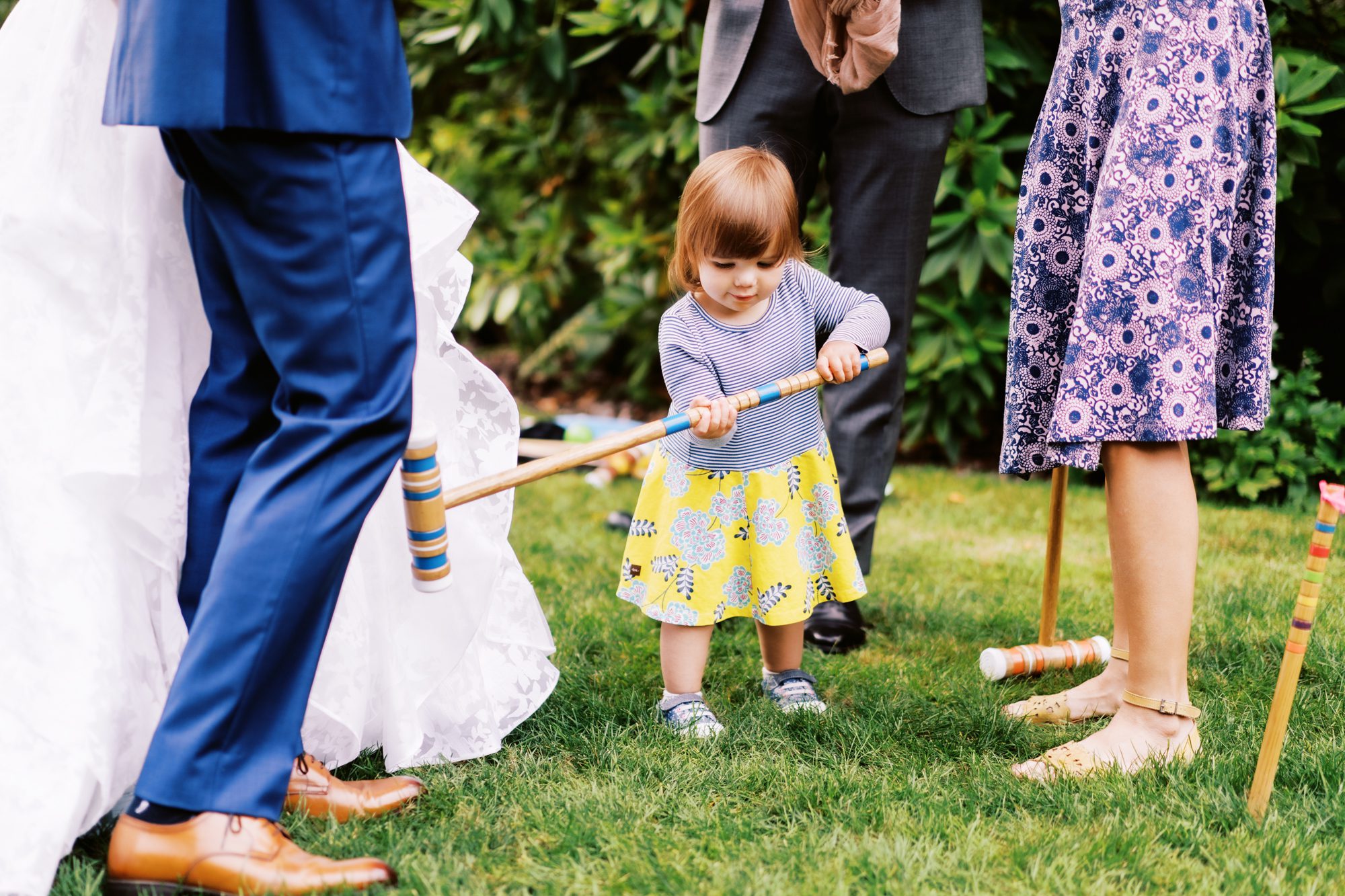 Seattle wedding photographer: Little girl plays croquet